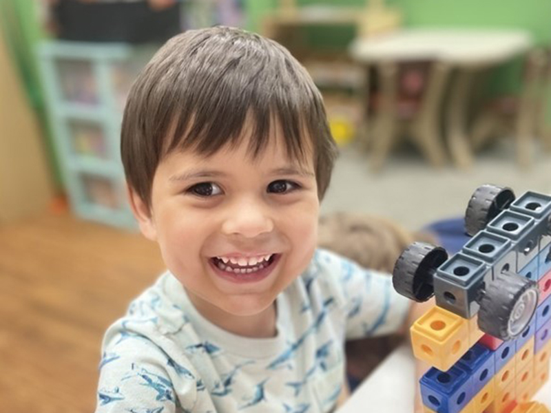 a little boy playing with a toy